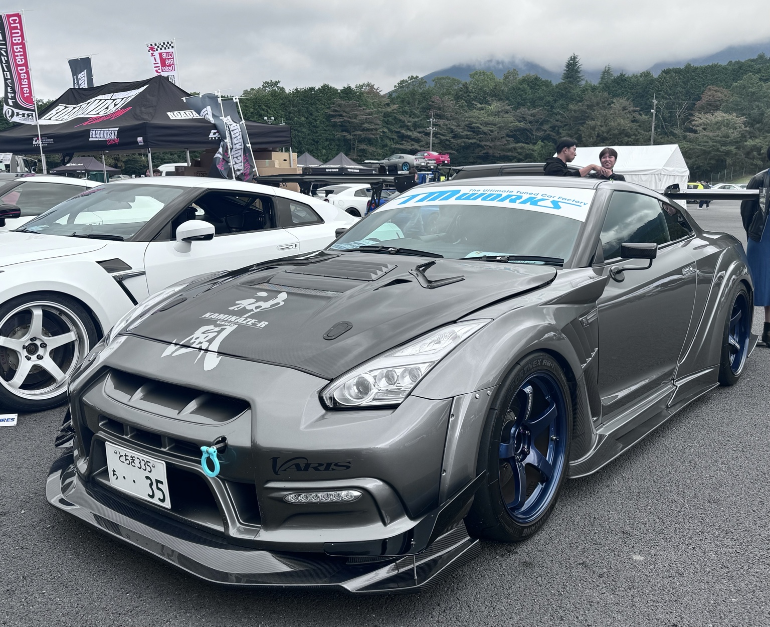 Grey modified R35 GT-R at a car event